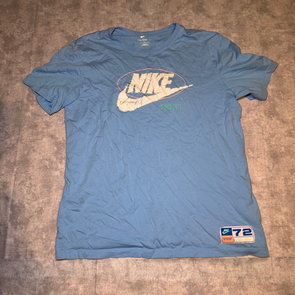 Nike Champions of Sport Graphic T-Shirt Blue Large Since 1972 Iridescent Logo